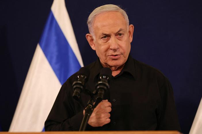 Israeli Prime Minister Benjamin Netanyahu speaks during a press conference in the Kirya military base in Tel Aviv on Oct. 28, amid ongoing battles between Israel and the Palestinian group Hamas.