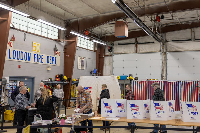 Voters wait to cast their ballots on Jan. 23 in Loudon, N.H. Shortly before voting began, some voters in the state got calls from a faked version of President Biden's voice urging them not to vote, a sign of the potential that deepfakes could have on the electoral process.