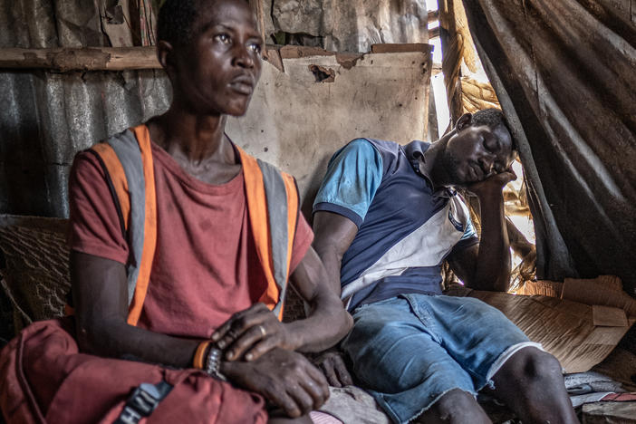 Kush users in a shack at the Kingtom dumpsite in Freetown, Sierra Leone. Cheap, quick to take effect and easily accessible, kush has proved dangerously appealing to a generation of young Sierra Leoneans growing up amid widespread poverty and unemployment.