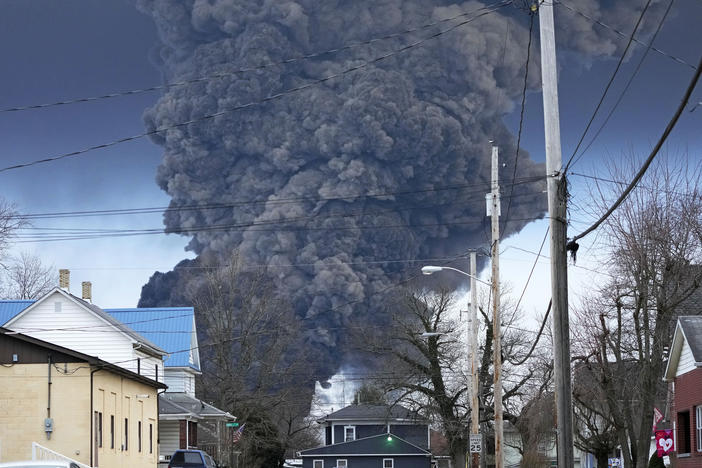 A black plume rises over East Palestine, Ohio, as a result of a controlled detonation of a portion of the derailed Norfolk Southern trains, Feb. 6, 2023.