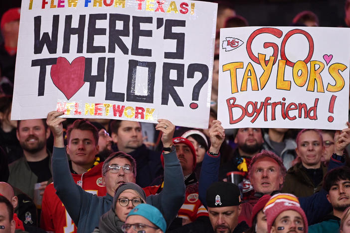 Fans hold up signs during the NFL game between Miami Dolphins and Kansas City Chiefs in Germany in November.