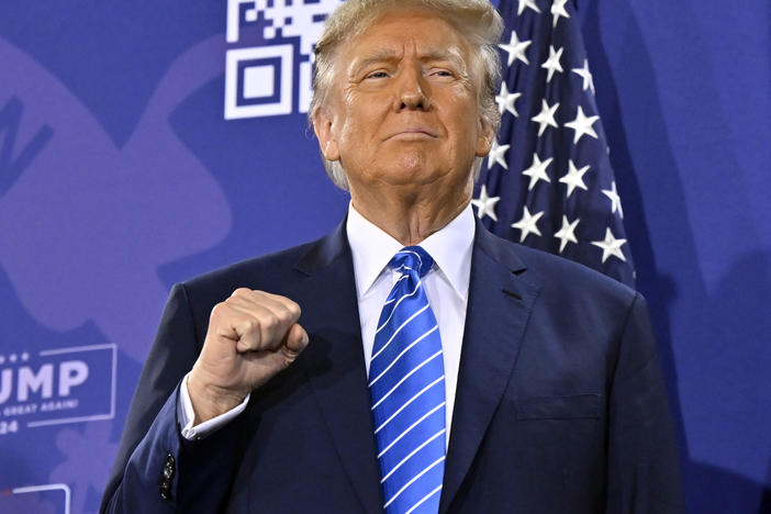 Republican presidential candidate and former President Donald Trump stands on stage during a campaign event in Las Vegas on Jan. 27, 2024.