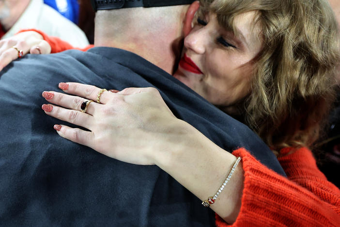 Taylor Swift hugs Kansas City Chiefs player Travis Kelce after a game last month against the Baltimore Ravens as she wears a diamond bracelet designed by Wove, a company founded by two former U.S. Army Rangers.