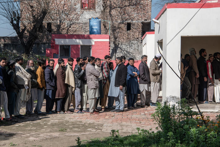 Pakistan voters queue to cast their ballots at a polling station in Pakistan's general election on Feb. 8, in Wahgrian, Pakistan. The elections have direct implications for Pakistan's global credibility, particularly in strategic and economic relationships.