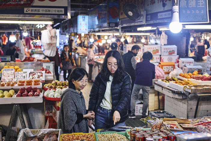 Ivy Chen (left) and Clarissa Wei browse Shuixian Gong Market in Tainan, Taiwan, in January.