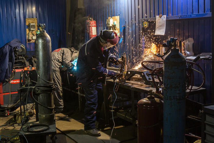 Armored car repair shop workers build an experimental version of a military vehicle in the facility of the Ukrainian Armor Design and Manufacturing Co.