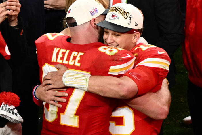 Kansas City Chiefs' tight end #87 Travis Kelce and Kansas City Chiefs' quarterback #15 Patrick Mahomes hug after winning Super Bowl LVIII against the San Francisco 49ers at Allegiant Stadium in Las Vegas, Nevada, February 11, 2024.