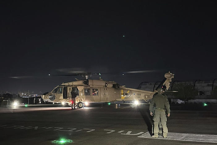 This photo provided by the Israeli military shows an Israeli Air Force helicopter carrying what the military said are two released hostages, at Sheba Medical Center in Ramat Gan, Israel, on Monday.