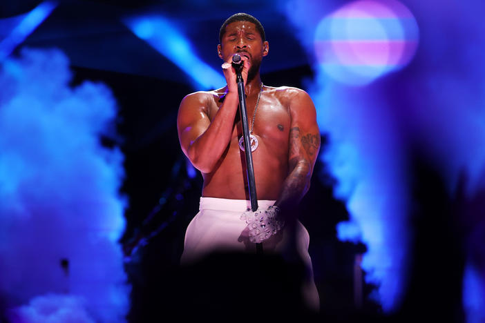 Usher performs onstage during the Apple Music Super Bowl LVIII Halftime Show at Allegiant Stadium in Las Vegas, Nevada.