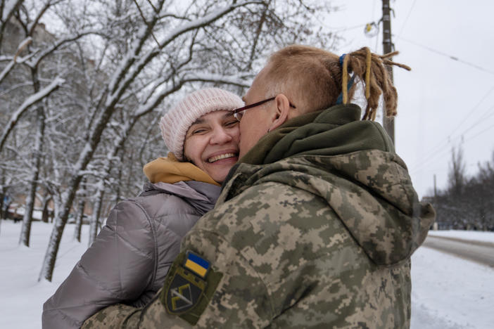 Yulya Dmytrieeva and her husband, Vadym, who have been together for over a decade, embrace in the snow in Sloviansk. They will spend a few days together while he has a break from the trenches on the front lines.