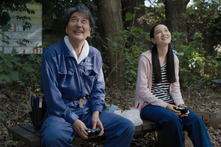Hirayama (Kōji<em> </em>Yakusho) sits with his niece Niko (Arisa Nakano) in <em>Perfect Days.</em>