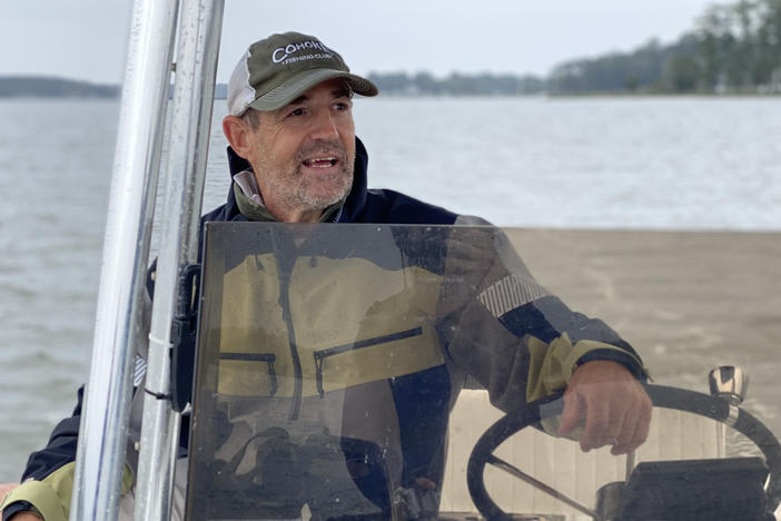 Chris Dollar steers his boat on the Ware River in Gloucester, Virginia in September. A charter fishing captain and conservation advocate, Dollar said he sees fewer fish in the bay and its tributaries than he used to. Schools of menhaden that used to be "the size of a football field" have shrunk to "maybe a tennis court," he said.