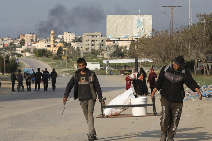 Palestinians are shown fleeing the Israeli offensive on Khan Younis arrive at Rafah, Gaza Strip. Wednesday, Feb. 14, 2024.