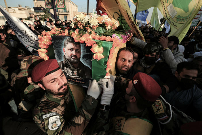 Fighters carry the coffin of Abu Baqir al-Saadi during his funeral on Feb. 8. He was a senior commander in Kataib Hezbollah, an Iran-backed Iraqi militia, who was killed in a U.S. drone strike in Baghdad.