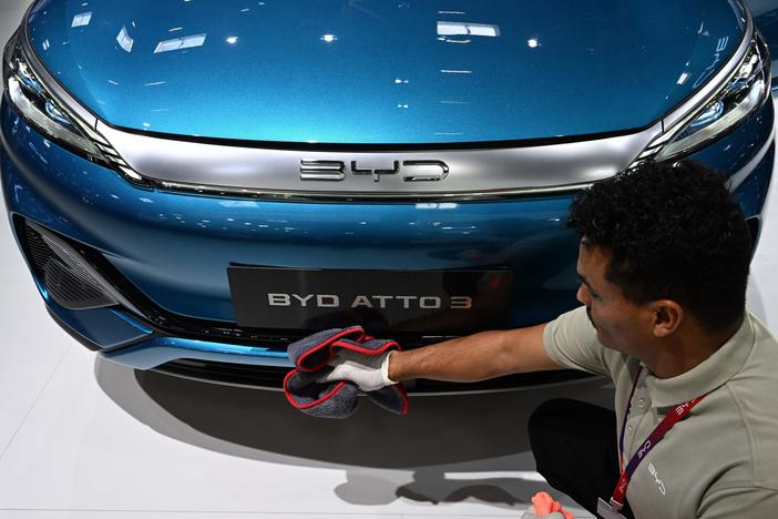 A man polishes an Atto 3 car from Chinese car maker BYD at the International Motor Show (IAA) in Munich, Germany, on Sept. 4, 2023. The car has gained in popularity among Europeans.