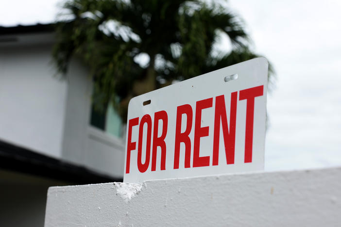 A "for rent" sign in front of a home in December 2023 in Miami, Florida. The price of rental properties began skyrocketing in 2020. They've come down a small amount, but studies show people across incomes are spending huge parts of their income on rent, leaving little left for other expenses.