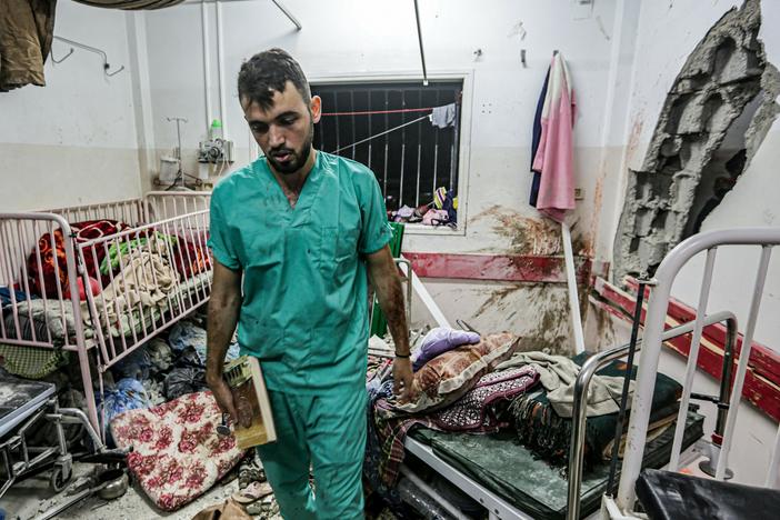 A man inspects the damage in a room following Israeli bombardment at Nasser Hospital in Khan Younis, southern Gaza Strip, on Dec. 17.