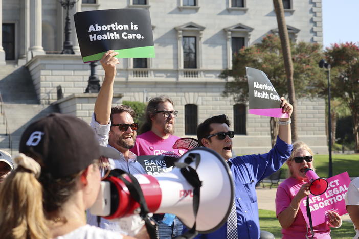 Over two dozen abortion-rights supporters attend a rally outside the South Carolina State House in Columbia, S.C., on Aug. 23, 2023. The South Carolina Supreme Court ruled to uphold a law banning most abortions except those in the earliest weeks of pregnancy.
