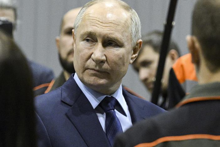 Russian President Vladimir Putin visits a factory on Thursday.