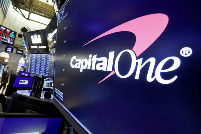 The logo for Capital One Financial is displayed above a trading post on the floor of the New York Stock Exchange, July 30, 2019. Capital One Financial is buying Discover Financial Services for $35 billion, in a deal that would bring together two of the nation's biggest lenders and credit card issuers, according to a news release issued by the companies Monday, Feb. 19, 2024.