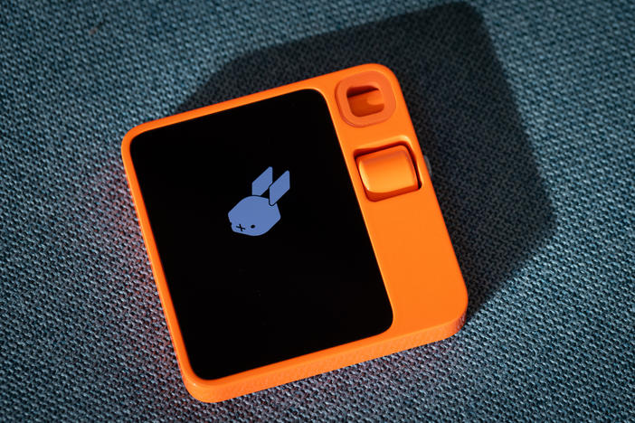 The AI-powered Rabbit R1 device is seen at Rabbit Inc.'s headquarters in Santa Monica, California. The gadget is meant to serve as a personal assistant fulfilling tasks such as ordering food on DoorDash for you, calling an Uber or booking your family's vacation.