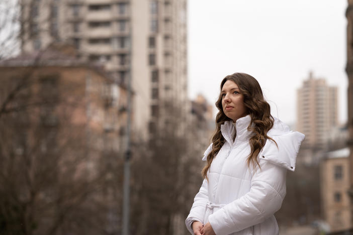 Lytvynova stands near an apartment building in her Kyiv neighborhood that was damaged by multiple Russian strikes over the course of the war.