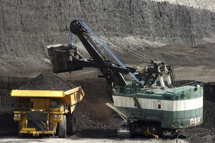 FILE - A mechanized shovel loads a haul truck that can carry up to 250 tons of coal at the Spring Creek coal mine, April 4, 2013, near Decker, Mont. On Wednesday, Feb. 21, 2024, a U.S. appeals court struck down a judge's 2022 order that imposed a moratorium on coal leasing from federal lands. (AP Photo/Matthew Brown, File)