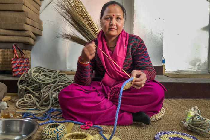 Sunita Kumari Chaudhary weaves a dinner table mat with ropes once used by climbers in the Himalayas. She and her fellow craftswomen are part of a small start-up project in Kathmandu Valley, Nepal, to repurpose Everest trash.
