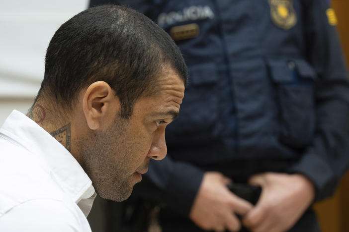 Brazilian soccer star Dani Alves sits during his trial in Barcelona, Spain, on Feb. 5, 2024. Alves has been found guilty of sexually assaulting a young woman in a Barcelona nightclub and has been sentenced Alves to 4 1/2 years in prison.