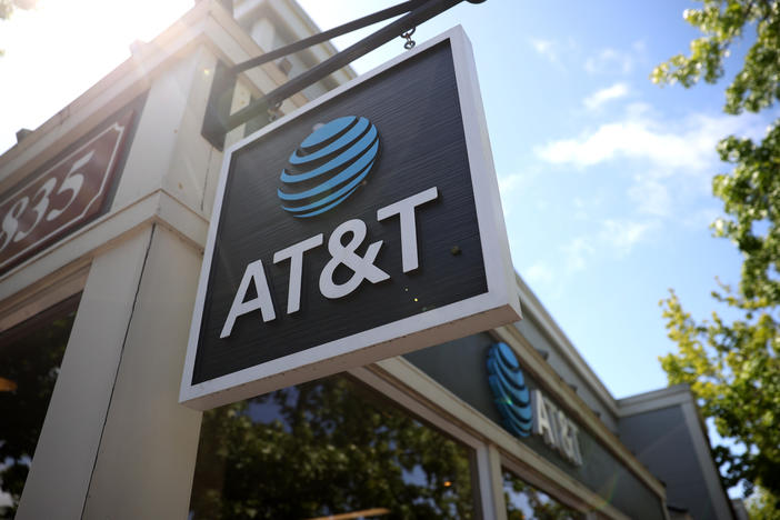 A sign is posted in front of an AT&T retail store in 2021 in San Rafael, Calif.