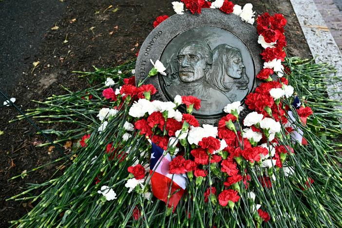 Flowers adorn the memorial plaque at the site where Orlando Letelier and Ronni Moffitt where killed in Washington, D.C. They were killed in a car bomb on Sept. 21, 1976, by agents of Chilean dictator Augusto Pinochet as they drove to work at the Institute for Policy Studies.