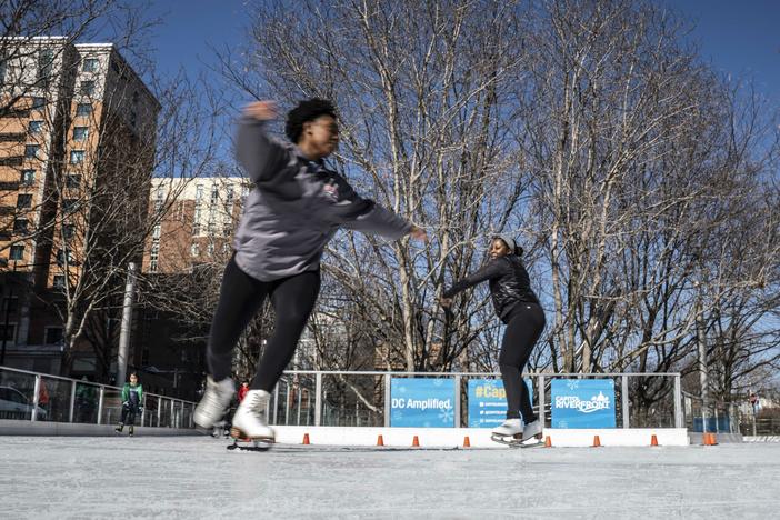 Cheyenne Walker and Maya James of Howard University's figure skating team practice their skills at Canal Park Ice Rink in Washington, D.C.