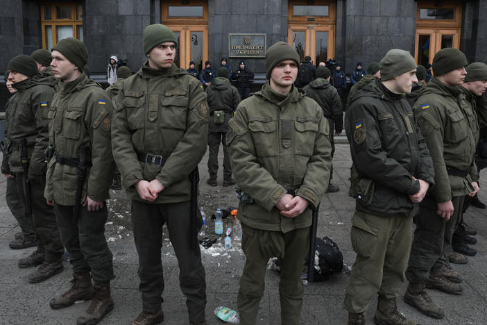 National Guards surround the place where a person immolated himself earlier in Kyiv, Ukraine, on Feb. 26, 2020. A man doused himself with a flammable liquid and set himself on fire in front of Presidential Office.