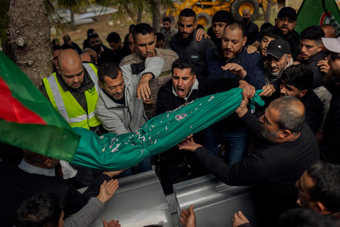 Relatives of Amal Hassan al-Durr, a 5-year-old girl, lay her body to rest at the cemetery in Majdal Zoun, southern Lebanon, on Feb. 22. She lost her life during an Israeli attack. In recent weeks, Israel has intensified its airstrikes, penetrating deeper into Lebanon.
