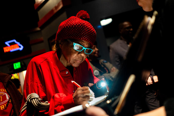 Janice Jernigans, 75, of St. Louis' Hyde Park neighborhood, signs a petition for a Missouri constitutional amendment that would legalize abortion up until fetal viability on Feb. 6 at The Pageant in St. Louis.