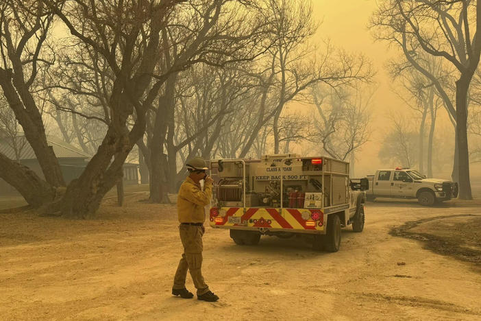 In this photo provided by the Flower Mound, Texas, Fire Department, Flower Mound firefighters respond to a fire in the Texas Panhandle, Tuesday, Feb. 27, 2024.