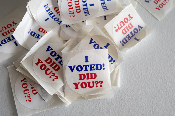 "I Voted" stickers on a table on the last day of early voting at a polling station inside Wayne County Community College Northwest Campus in Detroit on Feb. 25.