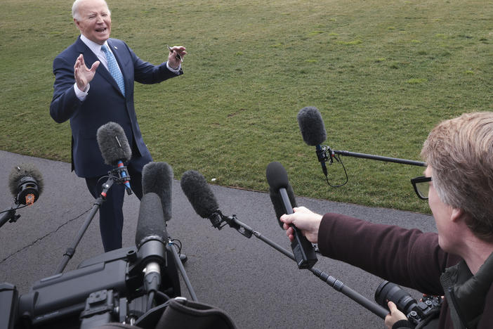Joe Biden answers questions while leaving the White House on January 30.