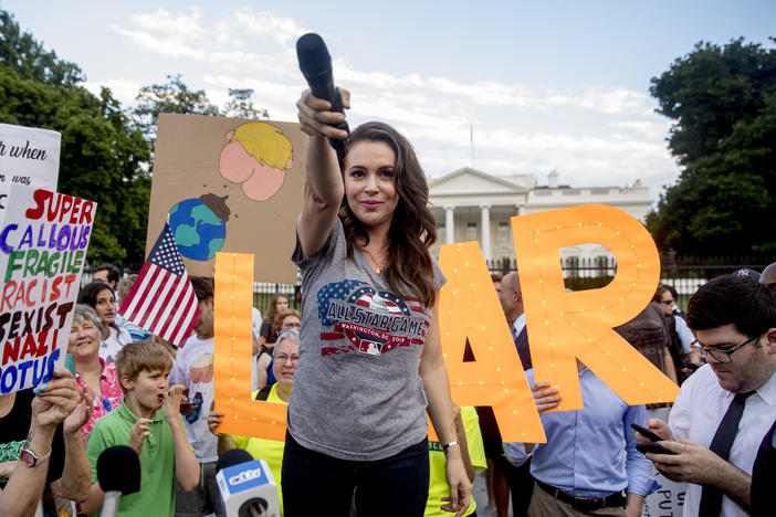 Alyssa Milano says that celebrity activism is at its best "when we are able to hand over the microphone" to the "incredible heroes" doing activism work day to day. She's pictured above in July 2018 at a protest following President Trump's meetings with Russia's Vladimir Putin. A longtime activist, Milano says it's impossible to avoid "the vitriol," especially when talking about the Middle East.