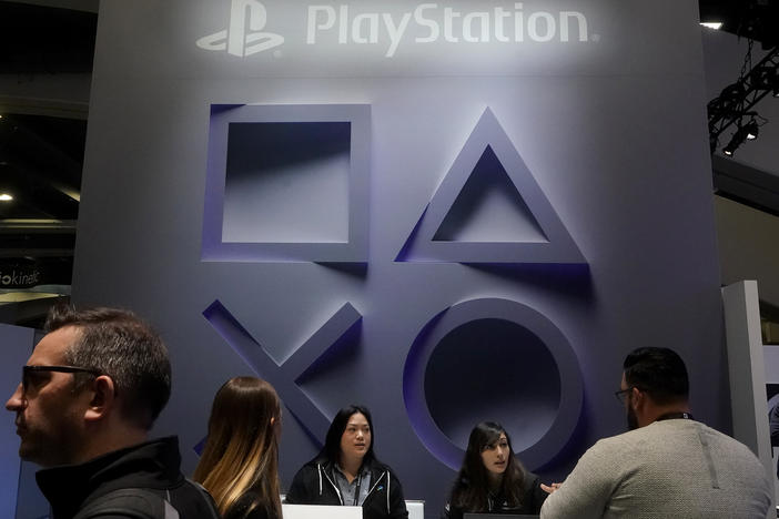 Attendees visit the PlayStation booth at the Game Developers Conference 2023 in San Francisco, Wednesday, March 22, 2023.