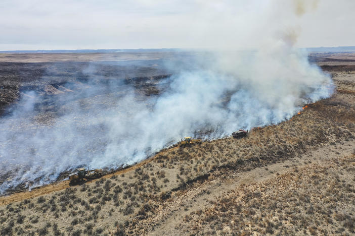 Firefighters battle the Smokehouse Creek Fire north of Canadian, Texas, on Wednesday, Feb. 28, 2024.