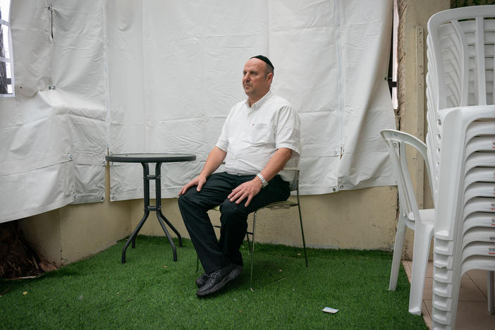 Chaim Otmazgin, 50, poses for a portrait in his home in Petah Tikva, Israel.