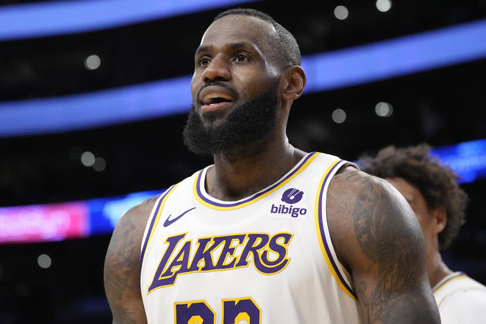 Los Angeles Lakers forward LeBron James looks toward fans after scoring during the second half of an NBA basketball game against the Denver Nuggets Saturday, March 2, 2024, in Los Angeles.