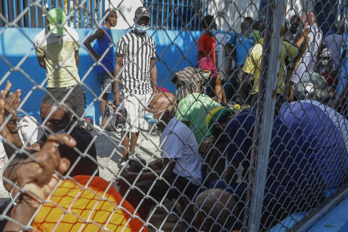 Inmates gather inside the National Penitentiary in downtown Port-au-Prince, Haiti, Sunday, March 3, 2024.