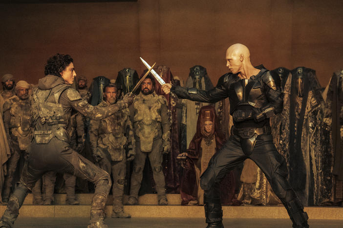 This image released by Warner Bros. Pictures shows Timothee Chalamet, foreground left, and Austin Butler in a scene from <em>Dune: Part Two</em>.