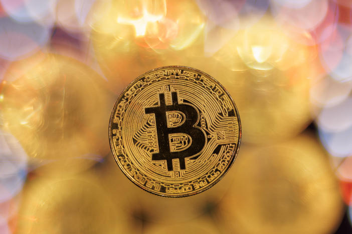 Bitcoin hit a record high following a rally sparked by the Securities and Exchange Commission's approval of bitcoin exchange-traded funds.