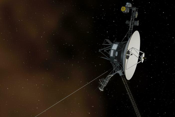 This artist's concept shows the Voyager 1 spacecraft entering the space between stars. Interstellar space is dominated by plasma, ionized gas (illustrated here as brownish haze).