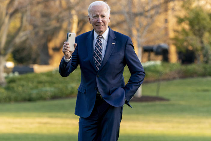 President Biden waves as he arrives at the White House on March 9, 2023.