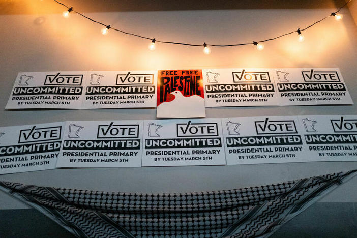 Placards adorn a wall at an Uncommitted Minnesota watch party during the presidential primary in Minneapolis on Super Tuesday.