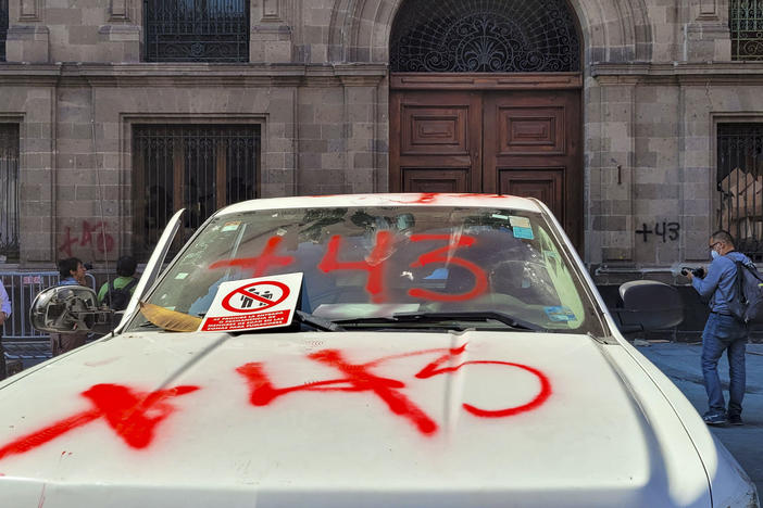 A view of the destruction caused by demonstrators outside the presidential palace in Mexico City on Wednesday, during a protest over the disappearance of the 43 students of the Ayotzinapa teaching training school in 2014. The group of demonstrators knocked down one of the doors of building with a pickup truck.